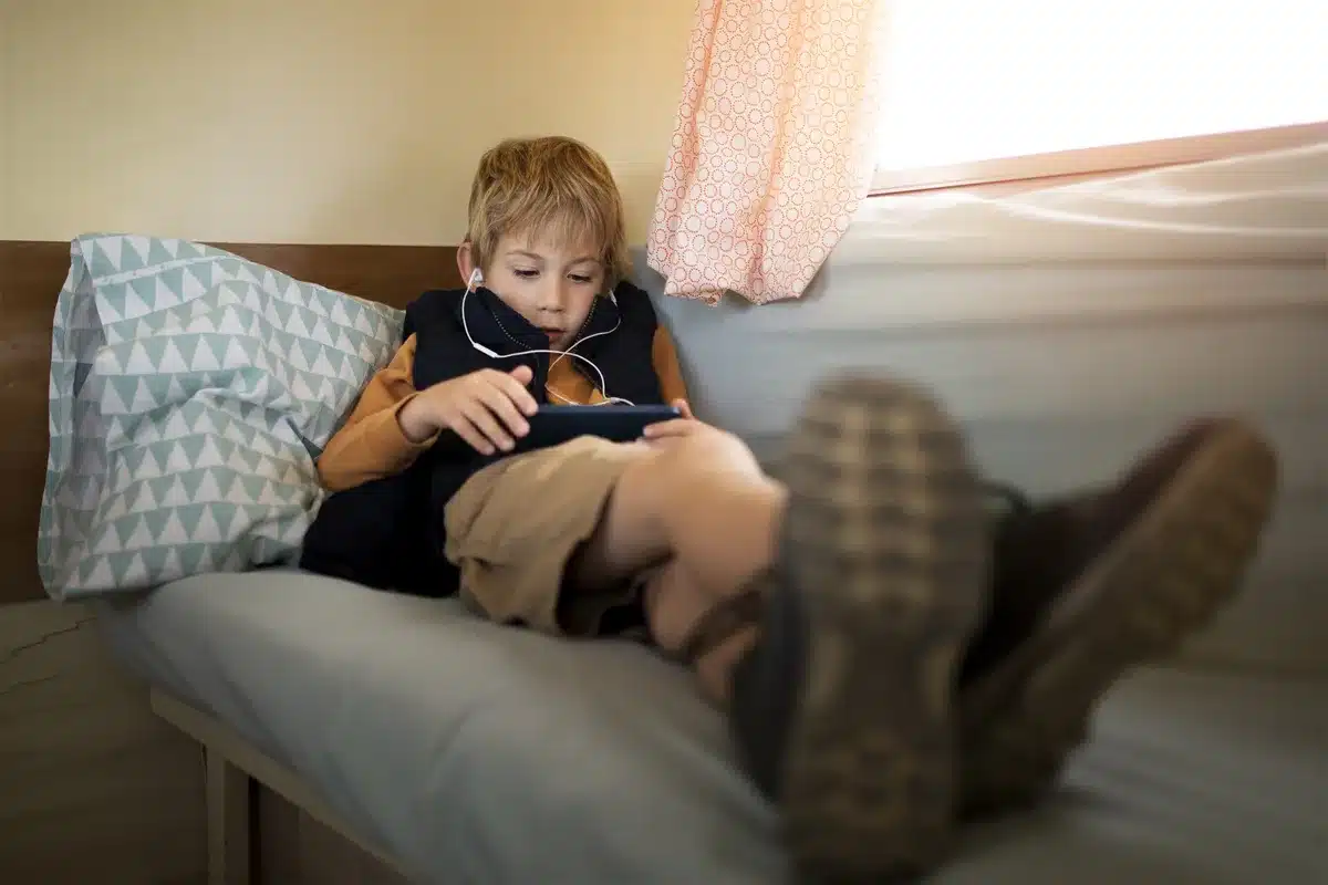 video game addiction - kid playing on tablet