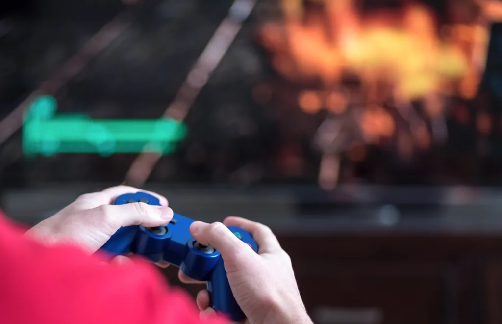 Child with controller playing a video game