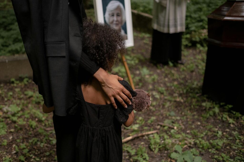 little girl at grandmother's funeral