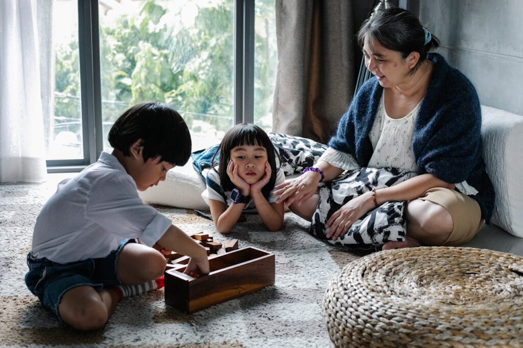 Two kids playing with their mother, showing signs of sibling rivalry.