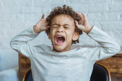 tantrums at 5 years old: little boy shouting