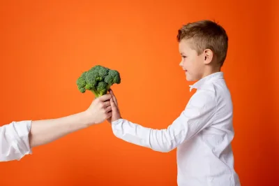 how to get kids to eat veggies - little boy refusing broccoli